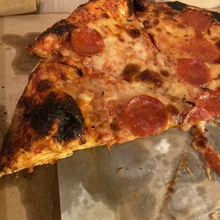 You can see the grease seeping onto the paper. Spots of crust were burnt. I am ok with a little burnt, but, this was too much. Gosh