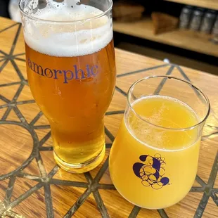 two glasses of beer on a table
