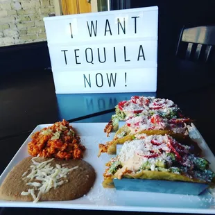 Baja Cowboy Tinga De Pollo, guacamole, Baja Pico De Gallo, pickled Fresno chili's, Chipotle &amp; honey creme and topped with cotija cheese.