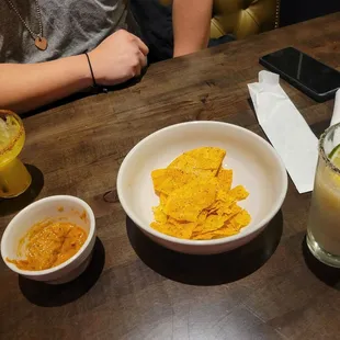First drinks and complimentary chips with dip.