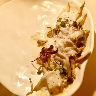 Mushroom with lots of fish sauce and some foam on top