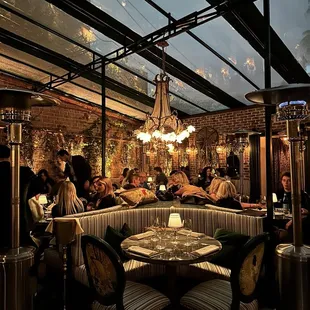 a group of people sitting at a table in a restaurant