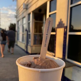 Single scoop Rocky Road ice cream. Outside of ice cream shop.