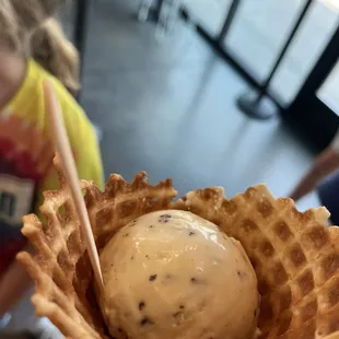 Chocolate chip ice cream in a waffle cone