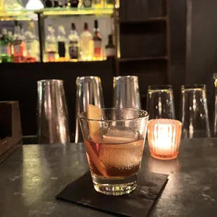 a drink in a glass on a bar