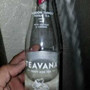 a hand holding a bottle of teavanana