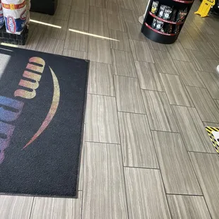 the floor of a store with a logo on it