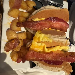 a breakfast sandwich with eggs and bacon