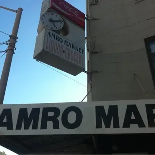 a clock hanging from the side of a building