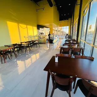 empty tables and chairs in a restaurant