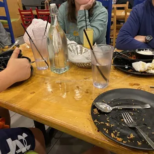 a group of people eating at a restaurant