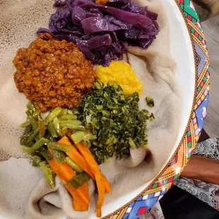 Vegetarian combo, lentil stew, cabbage, carrots and string beans.