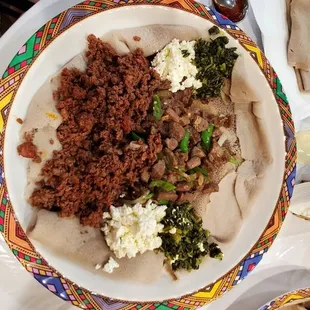 Kitfo (Steak Tartar), Ribs ( beef stir fry) cottage cheese and collard greens.