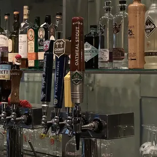 a row of beer taps