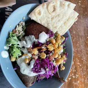 Salad half falafel half kebab with side and of pita
