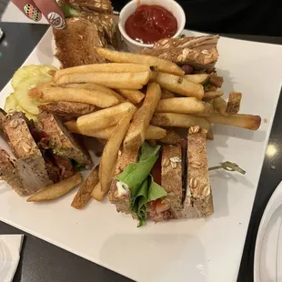 Turkey club sandwich and fries.