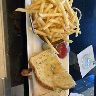 a plate of french fries and a sandwich