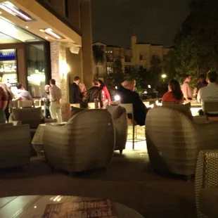 a group of people sitting at a bar