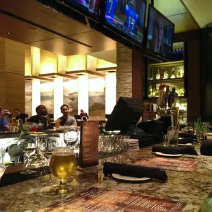 Outdoor Bar top that opens up into the hotel and flatscreens