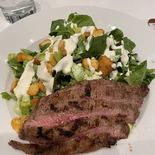 Caesar salad with steak.