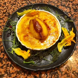 a plate of creme with flowers