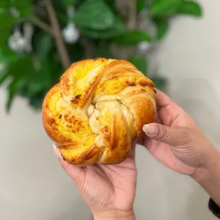 a person holding a pastry