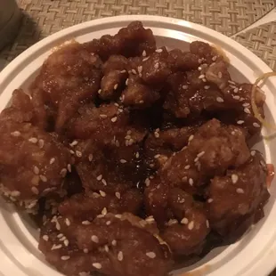 Nuked and sesame sprinkled ontop. No napkins or utensils provided in bag. Never will I return to this place