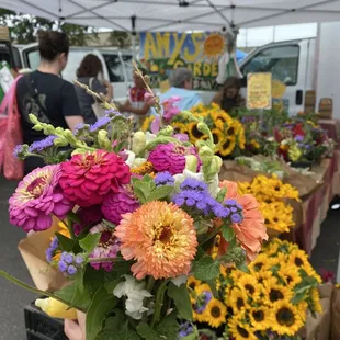 a person holding a bunch of flowers