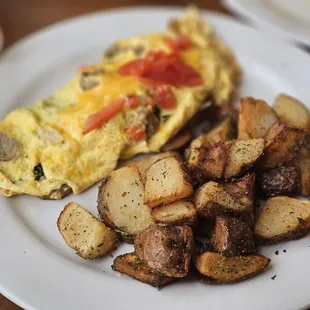 an omelet and potatoes