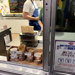 a woman behind a counter