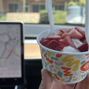 Vegan pistachio ice cream with fresh strawberries