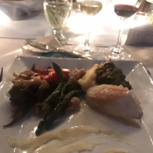 Halibut with beurre blanc, boneless braised short rib, garlic mashed potatoes and grilled vegetables