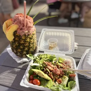 Poke Salad, the pineapple drink is from their neighbor across the way.