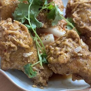 An An wings - Chicken in caramelized fish sauce with crispy garlic, cilantro, and lime.