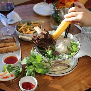 pork egg rolls, beef rib noodle soup, garlic fries