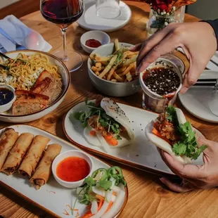 garlic noodles, pork egg rolls, bao, garlic fries