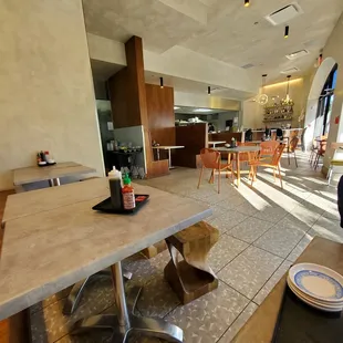 Restaurant interior. Simplistic Modern feels. Kind concrete colored, lol.