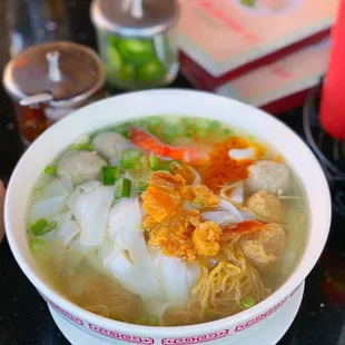 a bowl of soup with noodles and meat