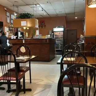 a restaurant with tables and chairs