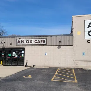 Entrance by the parking lot on the west side of the building