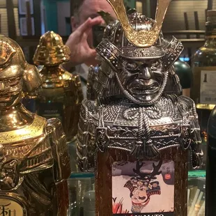 a person holding a bottle of liquor