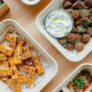 Our Thai spiced tofu is a fan favorite.  Enjoy it with home made falafel, yogurt &amp; dill.