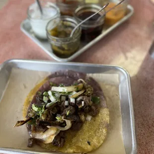 a taco with mushrooms and onions