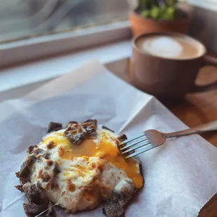 a piece of food on a napkin with a fork