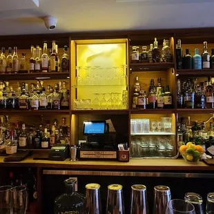 a bar with many bottles of alcohol