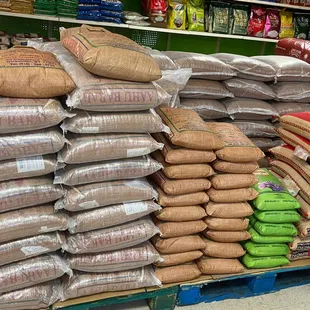a large stack of bags of rice
