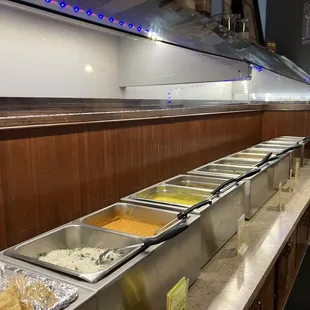 a long line of food being served