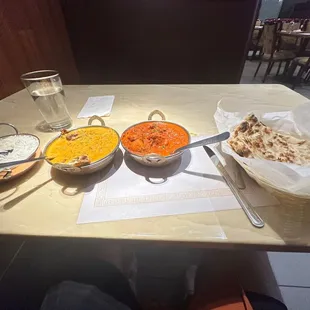 Chicken vindaloo, coconut Paneer Chili app and naan.
