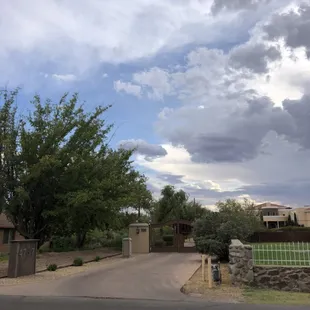 View from street. Go past gates straight to back of house to park