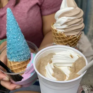 a person holding a cup of ice cream